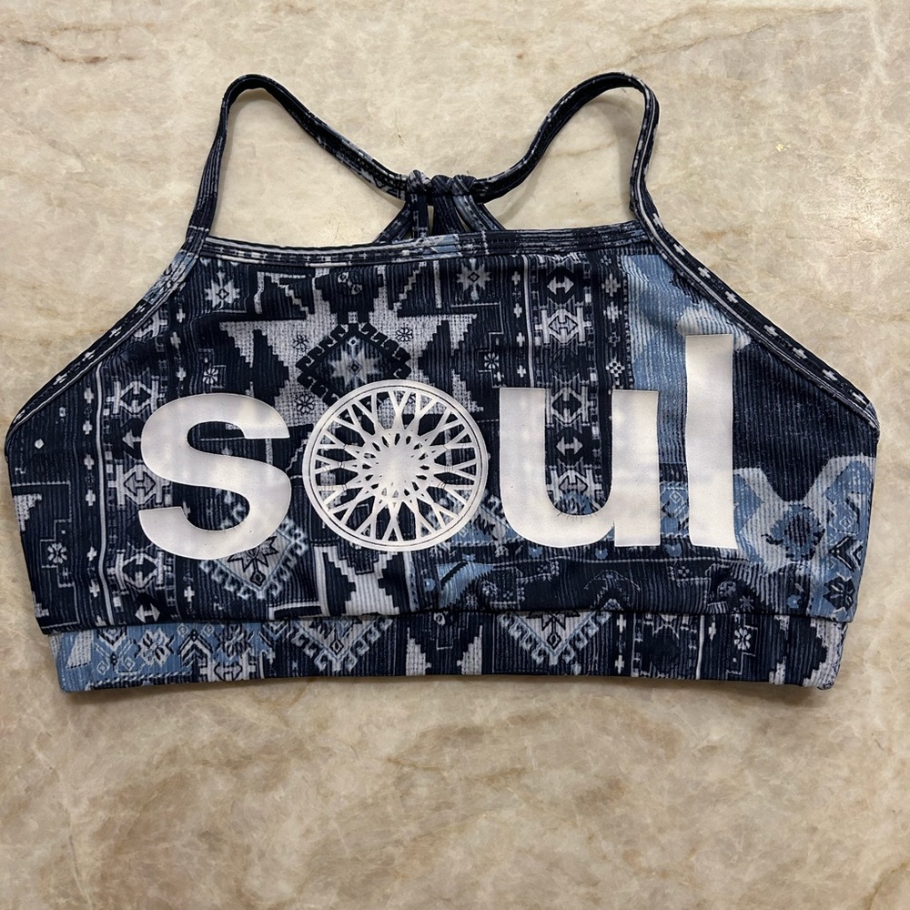 SOULCYCLE navy sports bra with a unique multi-strap caged back design.